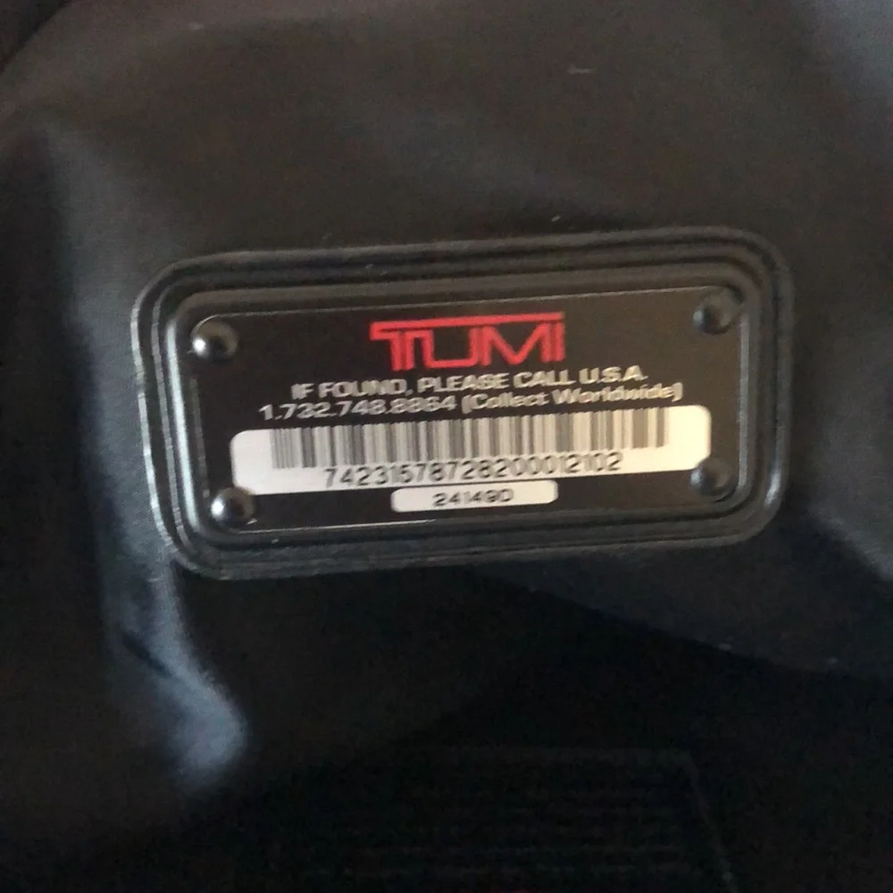 TUMI black Boston 2 way leather and canvas and mini lock. Detachable straps.
